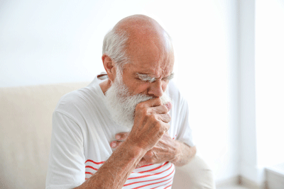 man coughing